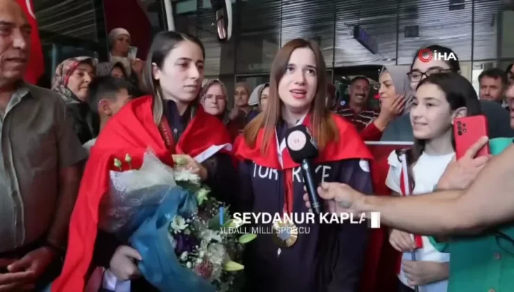 Olimpiyat şampiyonları çiçeklerle karşılandı